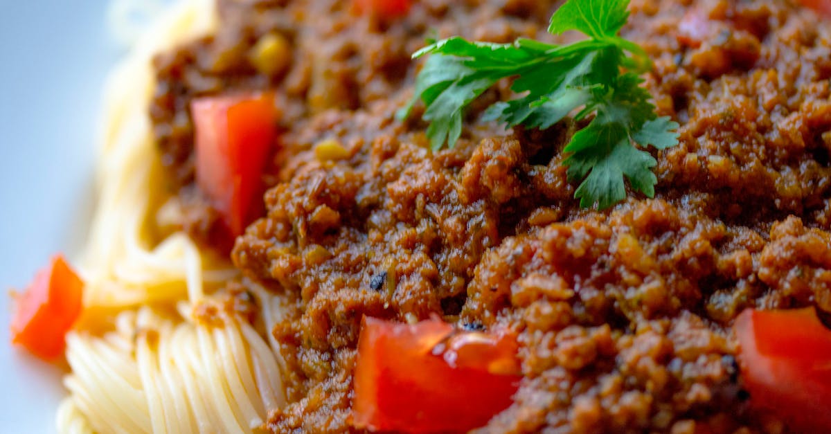 Why is there a watery run-off after cooking my bolognese? - Cooked Pasta With Sliced tomatoes and Green Leafy Why is there a watery run-off after cooking my bolognese? - Cooked Pasta With Sliced tomatoes and Green Leafy