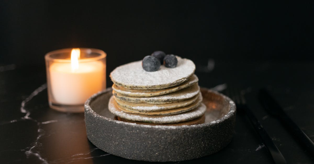Why is there cornstarch in powdered sugar? - Pancakes with blueberries near candle candle on table Why is there cornstarch in powdered sugar? - Pancakes with blueberries near candle candle on table