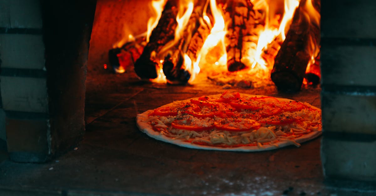 Why is this (and other?) pizza oven so unnecessarily tall? - Pizza In Oven Why is this (and other?) pizza oven so unnecessarily tall? - Pizza In Oven