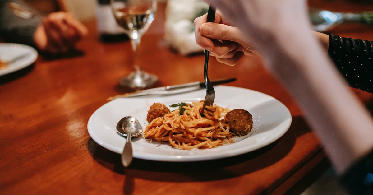 Why is wine not a common ingredient in (meat) stock? - Crop anonymous female enjoying tasty yummy spaghetti with meat ball and glass of white wine in restaurant Why is wine not a common ingredient in (meat) stock? - Crop anonymous female enjoying tasty yummy spaghetti with meat ball and glass of white wine in restaurant