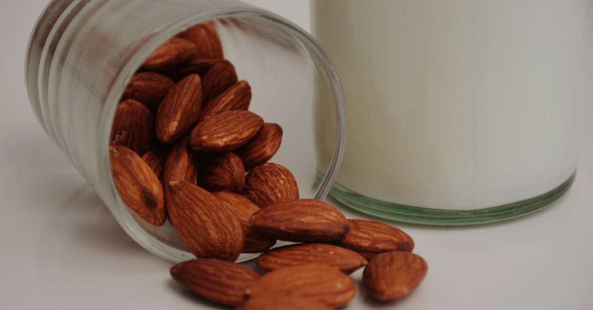 Why isn't Almond Milk (and other non-animal based 'milk') considered juice? - Fallen glass with crunchy almonds near milk Why isn't Almond Milk (and other non-animal based 'milk') considered juice? - Fallen glass with crunchy almonds near milk