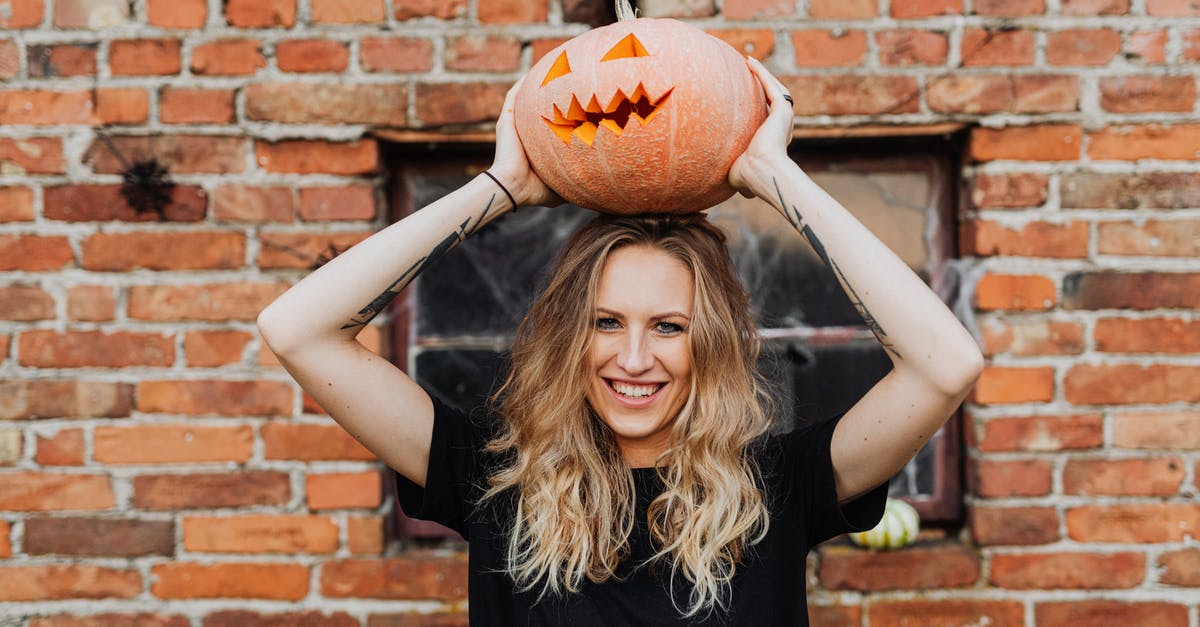 Why isn't liver bitter? - Woman in Black Sleeveless Shirt Holding Jack O Lantern