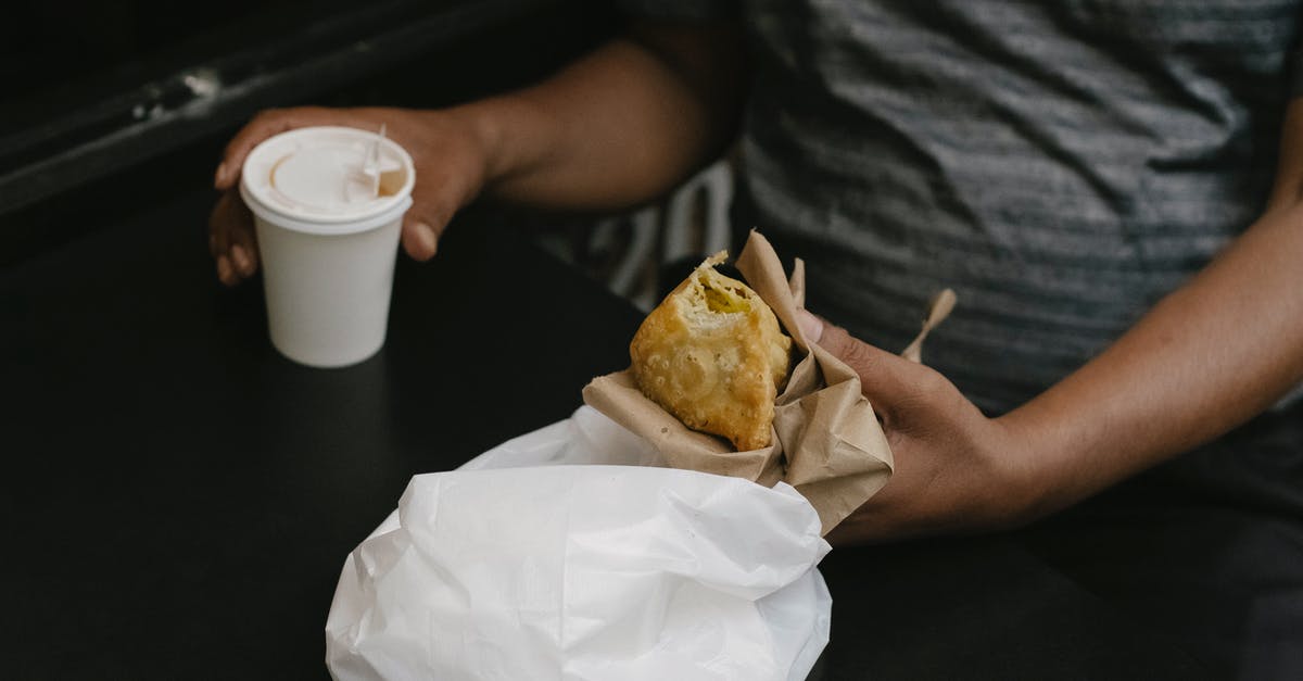 Why let your pie cool instead of eating it hot? - Crop person with cheburek and coffee Why let your pie cool instead of eating it hot? - Crop person with cheburek and coffee