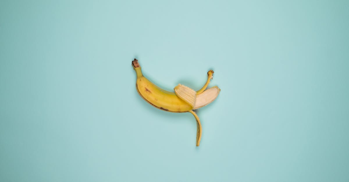 Why my banana sauce is not smooth? - Top view backdrop of tasty whole banana with blots on yellow peel and curved stalk Why my banana sauce is not smooth? - Top view backdrop of tasty whole banana with blots on yellow peel and curved stalk