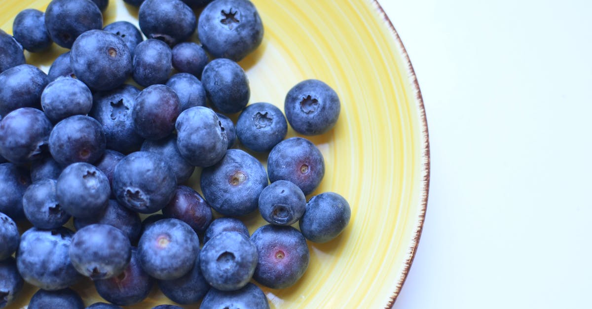 why pepitas (pumpkin seeds) taste like blue cheese? - Top view of natural juicy blueberry with sweet taste on yellow ceramic plate why pepitas (pumpkin seeds) taste like blue cheese? - Top view of natural juicy blueberry with sweet taste on yellow ceramic plate