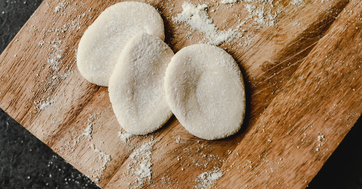 Why should i add the butter after i knead the main ingredients when making a bread? [duplicate] - White Powder on Brown Wooden Table