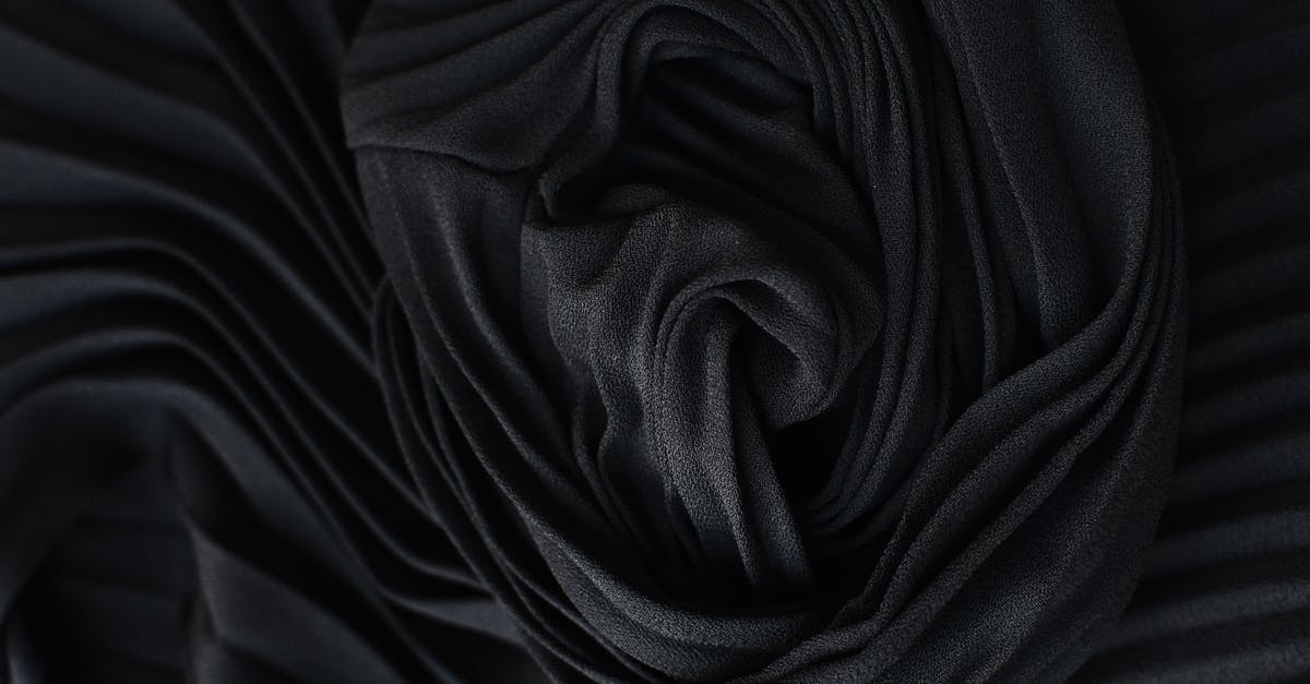 Why skim "scum" from the surface of a simmering stock? - Black pleated fabric placed on table Why skim "scum" from the surface of a simmering stock? - Black pleated fabric placed on table