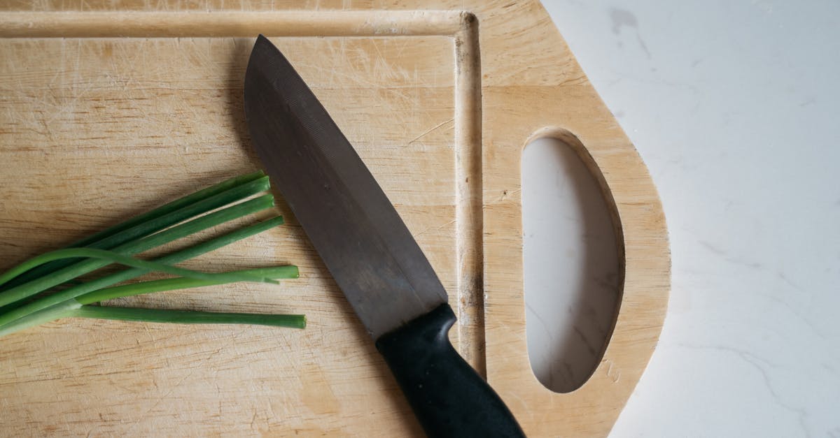 Why stud an onion? - Black Handled Knife on Brown Wooden Chopping Board Why stud an onion? - Black Handled Knife on Brown Wooden Chopping Board