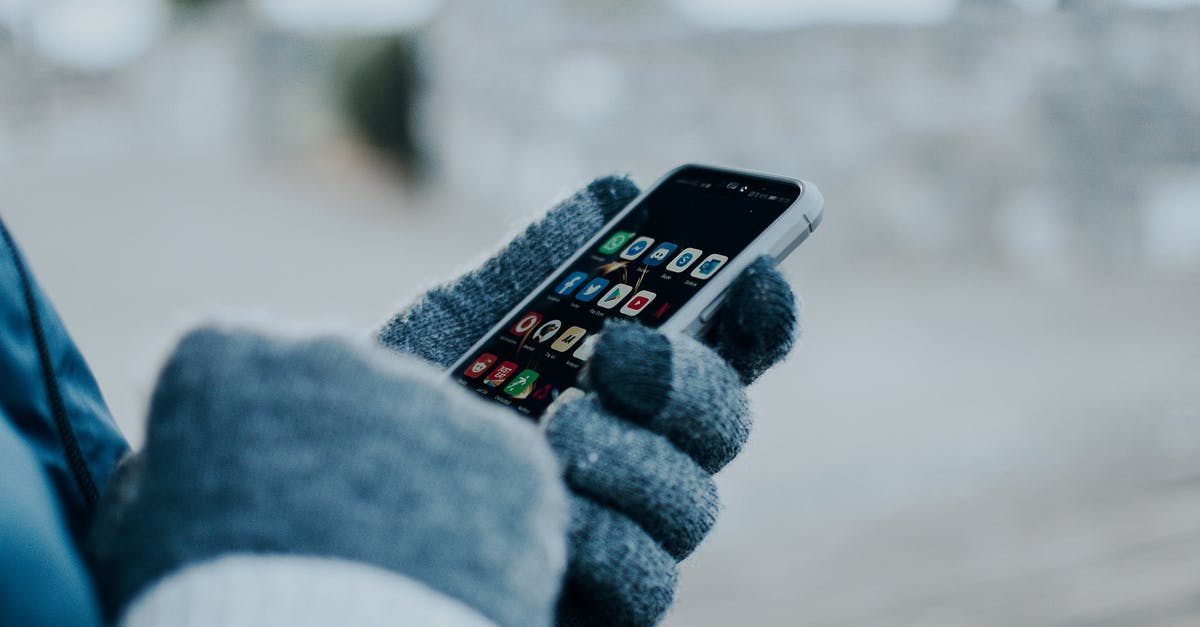 Why use gloves when handling food? - Person Wearing Gloves Holding a Cellphone Why use gloves when handling food? - Person Wearing Gloves Holding a Cellphone