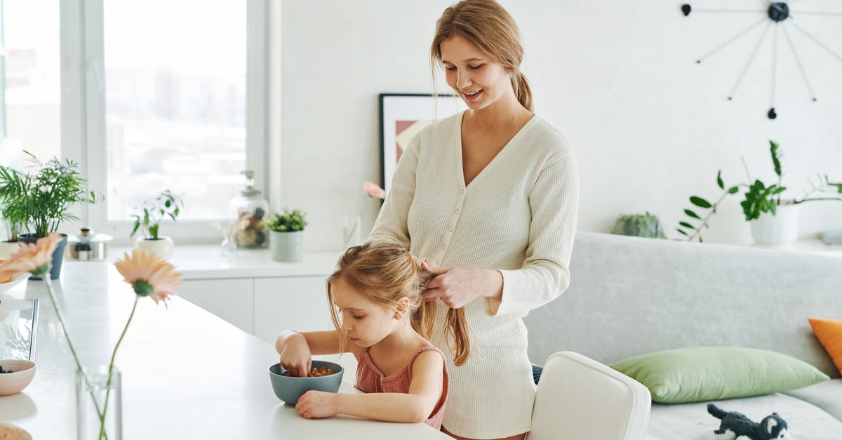 Why would a pregnant woman not be able to eat soft cheeses? [closed] - A Woman Braiding the Hair of a Young Girl