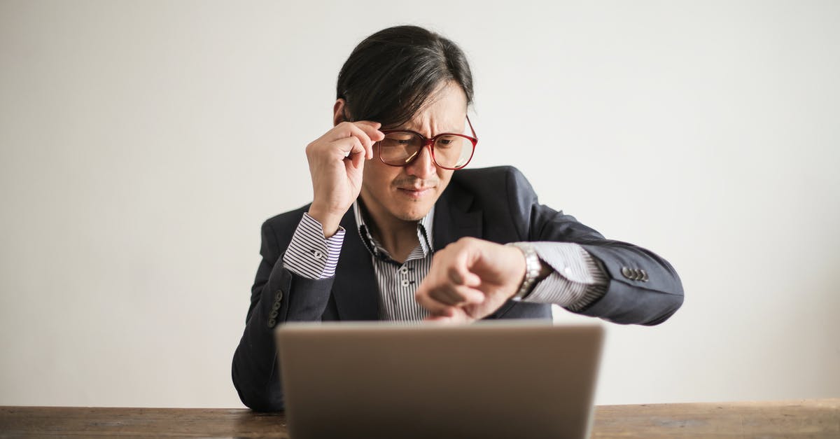 Why would a pressure cooker shorten a braise time? - Young frowning man in suit and glasses looking at wristwatch while waiting for appointment sitting at desk with laptop Why would a pressure cooker shorten a braise time? - Young frowning man in suit and glasses looking at wristwatch while waiting for appointment sitting at desk with laptop