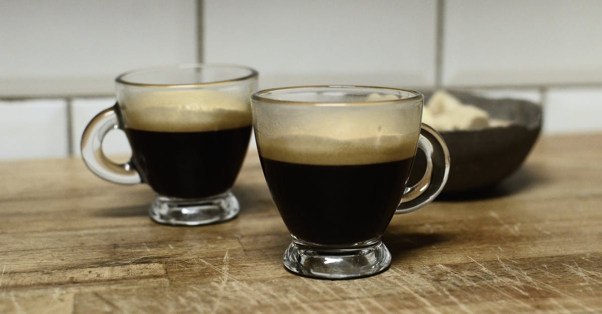 Why would coffee cause stomach cramps? Are there alternatives to Caffeine? [closed] - Clear Glass Mug With Brown Liquid on Brown Wooden Table
