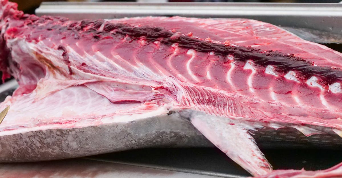 Why would fresh tuna be salted? - White and Pink Sliced Fish on the Table
