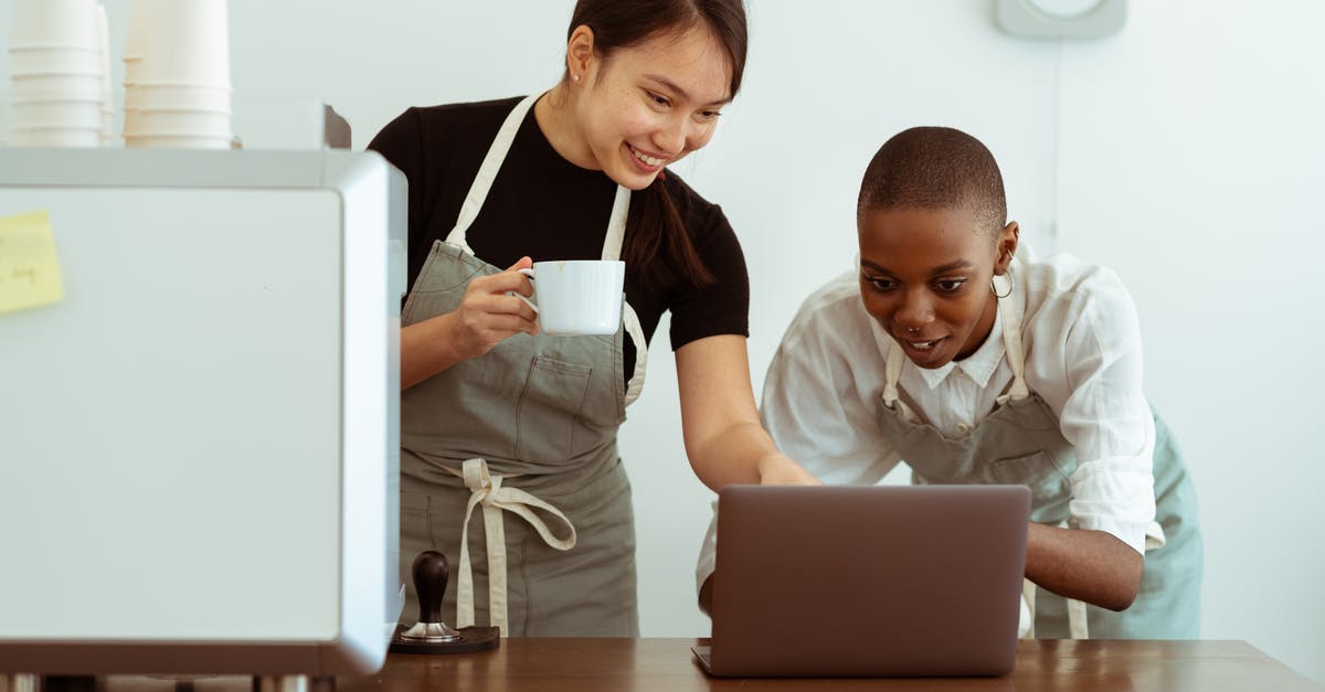 Why would rasagullas break while cooking? - Joyful smiling multiracial waitresses surfing internet on contemporary netbook and smiling while having coffee break in cozy kitchen Why would rasagullas break while cooking? - Joyful smiling multiracial waitresses surfing internet on contemporary netbook and smiling while having coffee break in cozy kitchen