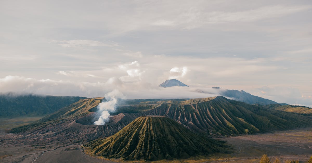 Wild Salmon from grill is too dry - From above of picturesque scenery of volcanic mountains located in vast desolate terrain under cloudy sky Wild Salmon from grill is too dry - From above of picturesque scenery of volcanic mountains located in vast desolate terrain under cloudy sky