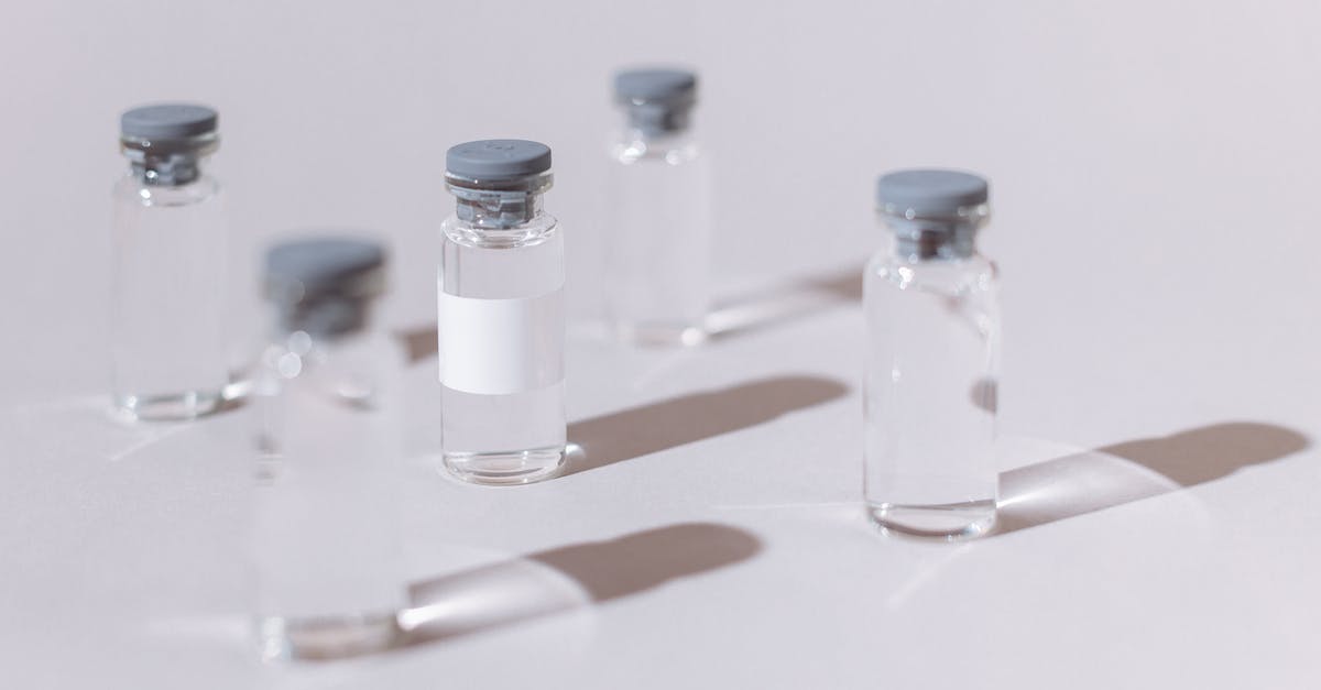 Will a dishwasher sterilize bottles for canning? - Five Clear Glass Bottles on White Table Will a dishwasher sterilize bottles for canning? - Five Clear Glass Bottles on White Table
