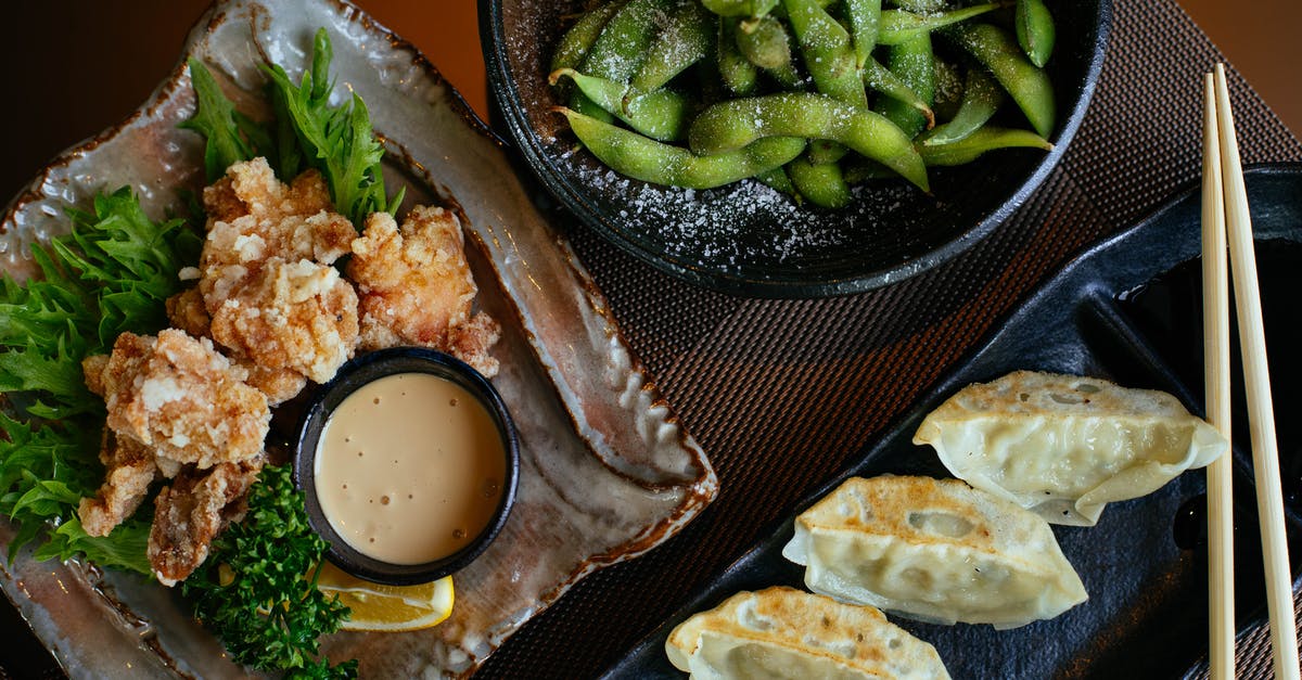 Will coated chicken fry up ok if not fried right away? - Dumplings on Black Plate Beside Green Beans and Fried Food Will coated chicken fry up ok if not fried right away? - Dumplings on Black Plate Beside Green Beans and Fried Food