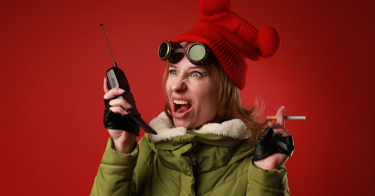 Will using 4 year old unsalted butter make one sick? - Annoyed female model in outerwear with old goggles yelling into walkie talkie while looking away on red background Will using 4 year old unsalted butter make one sick? - Annoyed female model in outerwear with old goggles yelling into walkie talkie while looking away on red background