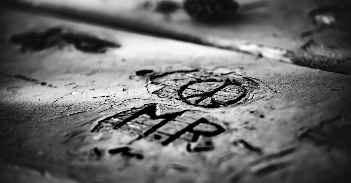 Wooden vs Anti Microbial Cutting Board For Carving Meat - From above closeup black and white of old rectangular wooden planks with uneven shabby surface and cut out letters near circle with lines inside in daylight Wooden vs Anti Microbial Cutting Board For Carving Meat - From above closeup black and white of old rectangular wooden planks with uneven shabby surface and cut out letters near circle with lines inside in daylight