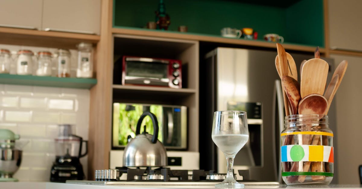 Would refrigeration lengthen shelf life for this water sweetener? - Glass of cold water and wooden utensils in jar placed on counter near stove with kettle in cozy kitchen with modern appliances Would refrigeration lengthen shelf life for this water sweetener? - Glass of cold water and wooden utensils in jar placed on counter near stove with kettle in cozy kitchen with modern appliances