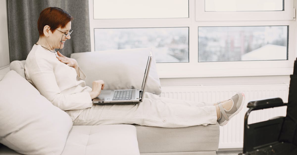Would this be called matured cream? - A Mature Woman Sitting on Sofa Using a Laptop Would this be called matured cream? - A Mature Woman Sitting on Sofa Using a Laptop