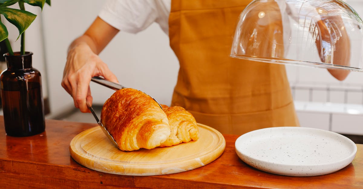 Would this cheat puff pastry really work? - Crop anonymous female employee in apron putting tasty pastries with tongs on plate in bakery Would this cheat puff pastry really work? - Crop anonymous female employee in apron putting tasty pastries with tongs on plate in bakery