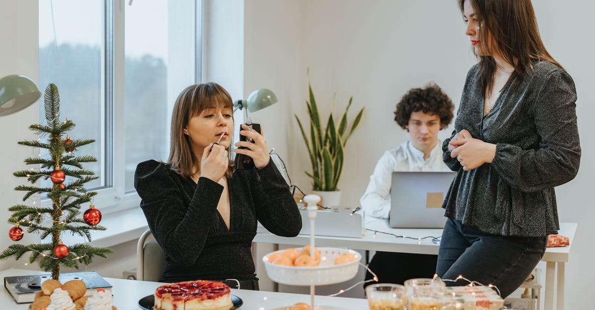 Xmas Pudding put in microwave by mistake for 5 minutes - Photo of a Woman Putting on Lip Tint on Her Lips Near Another Woman Xmas Pudding put in microwave by mistake for 5 minutes - Photo of a Woman Putting on Lip Tint on Her Lips Near Another Woman