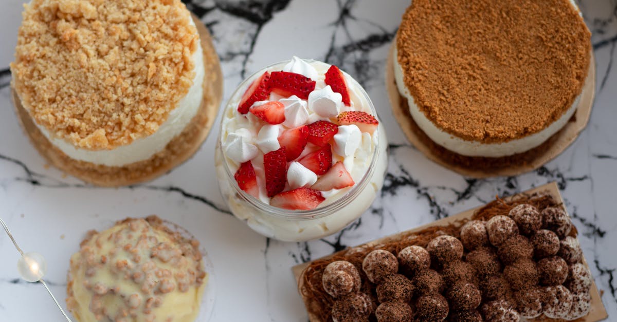 Zabaglione for Tiramisu - Set of delicious deserts on marble table Zabaglione for Tiramisu - Set of delicious deserts on marble table