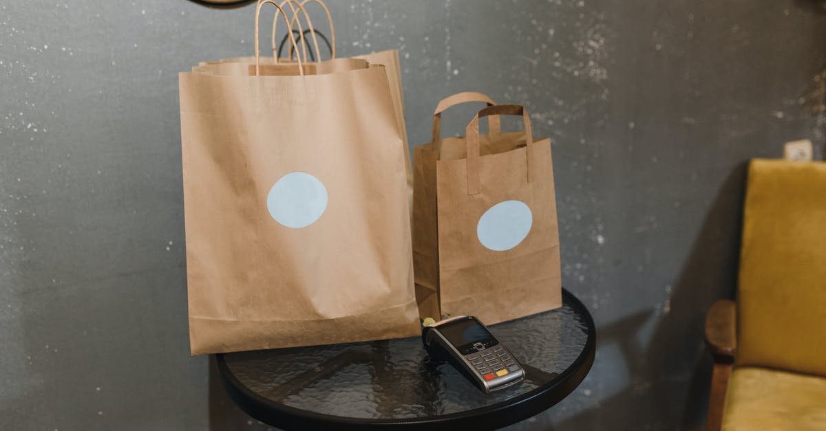 Ziploc vacuumed bags expand in sous vide - Brown Paper Bag on Round Black Table Ziploc vacuumed bags expand in sous vide - Brown Paper Bag on Round Black Table